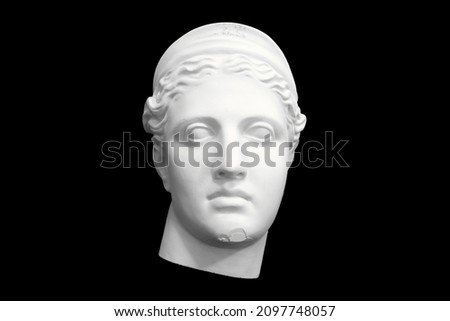 bust head of a woman made of plaster cast isolated on black background. High quality photo