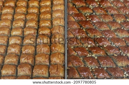 photo of a tray of baklava dessert with syrup and butter prepared