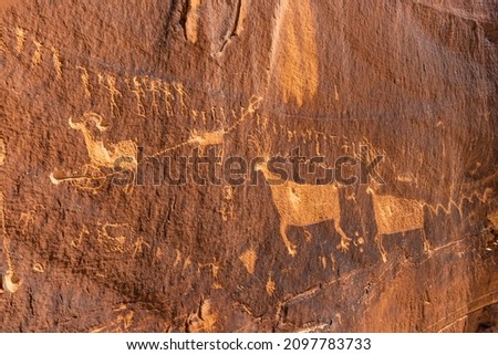 The Procession Panel, a well-known Ancetral Puebloan petroglyph panel near the top of Comb Ridge in Bears Ears National Monument, Utah. Royalty-Free Stock Photo #2097783733