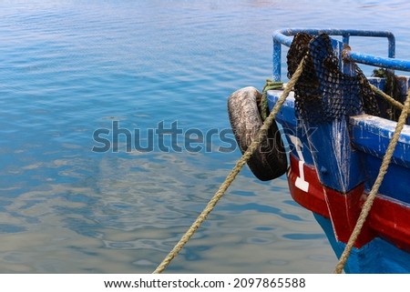 The bow of a boat in a blue sea