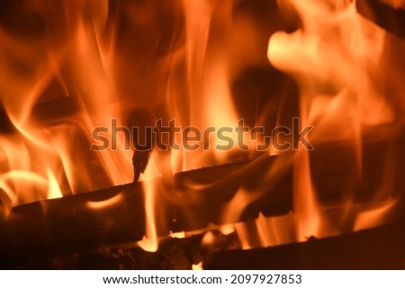 Cozy and warming log fire in the fireplace, in the province of Alicante, Spain