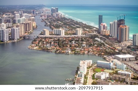 Aerial view of Miami Beach buildings and canals on a cloudy day, Florida