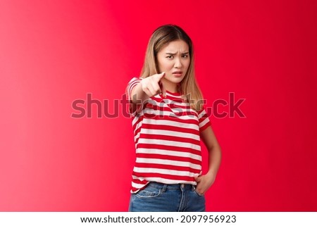 Girl plead you guilty. Upset asian blond girlfriend being cheated on pointing camera blame person make accusations, frowning disappointed and hurt, stand red background bothered offended Royalty-Free Stock Photo #2097956923