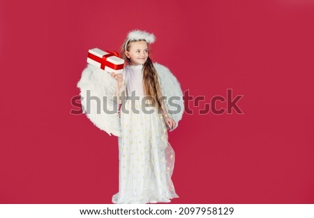Valentine gift child emotions. Little cupid girl. Kid angel with present. Little angel with white wings holds gift. Little prince greeting card. Valentines day.