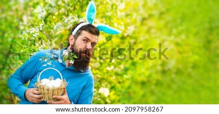 Happy easter. Humorous series of a man in bunny suit. Good for Easter or ironic situations. Banner.
