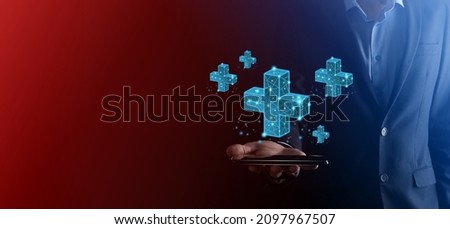 Businessman hand holding 3D plus low polygonal icon.Plus sign virtual means to offer positive thing like benefits, personal development, social network Profit,health insurance, growth concepts