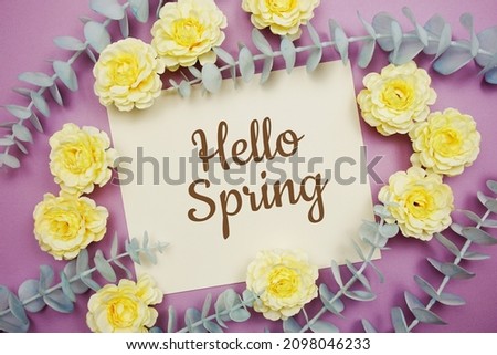 Hello Spring typography text and flower decorate on purple background