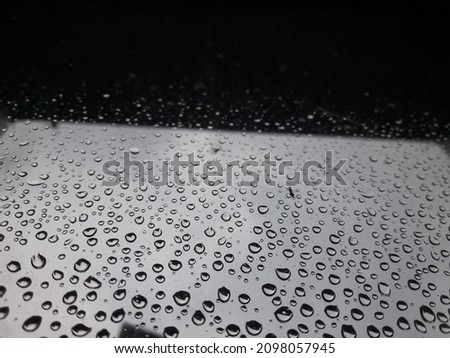 Raindrops sticking to the window pane