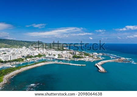 Aerial view of Taiwan harbor, shore and coastline. Bird eye of shore, wave, cloud, coastline,  white house and mountain in Chenggong harbor nearby Sanxiantai, Chenggong Township, Taitung country Royalty-Free Stock Photo #2098064638