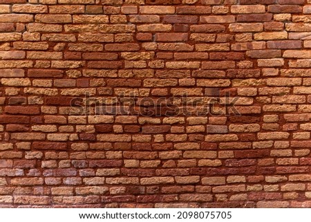 Red grunge brick wall, abstract background texture with old dirty and vintage style pattern. Stock photo