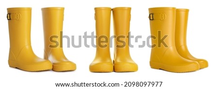 Set with yellow rubber boots on white background. Banner design Royalty-Free Stock Photo #2098097977
