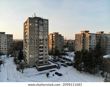 Multi-storey apartment building at winter in Eiguliai district in Kaunas, Lithuania. Aerial view photo. Investment, rent, real estate concept