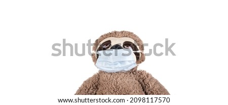 Soft toy in a mask. Health concept. Pandemic and wearing masks