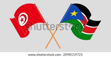 Crossed and waving flags of Tunisia and South Sudan. Vector illustration

