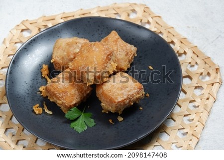 asian food,deep fried tofu in black  plate