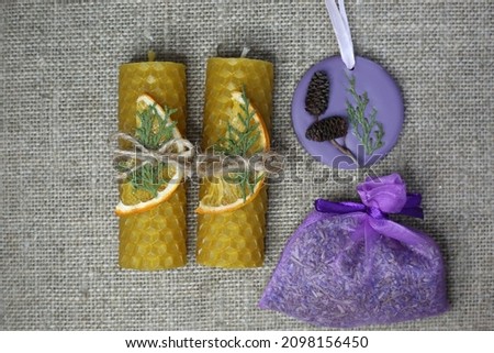 Handmade yellow honeycomb beeswax candles. Natural decorated candles in gift box.
