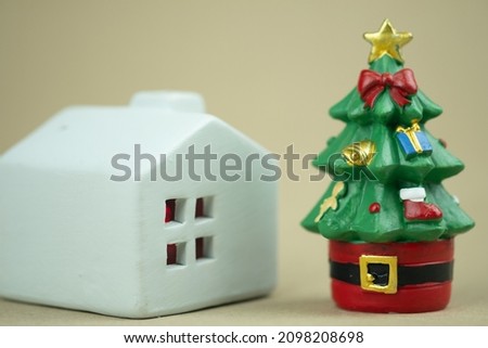 White house and Christmas tree ceramic for decorative in home. Close up