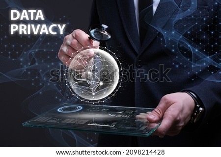 Business, Technology, Internet and network concept. Financial Graph. Stock Market chart. Young businessman working on a virtual screen of the future and sees the inscription: Data privacy