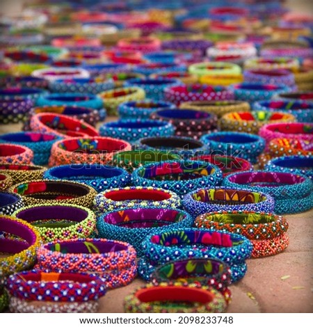 Intricately crafted  bead bangles by the artisans of Western India. These beautiful bangles are handcrafted by the artisan  families since generations. Royalty-Free Stock Photo #2098233748