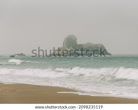 Sea stack in the Pacific Ocean, seen from the Elephant Seal Viewing Point, in San Simeon, California