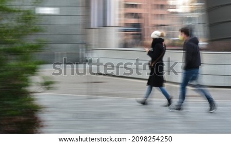 friends walking motion blur daylight