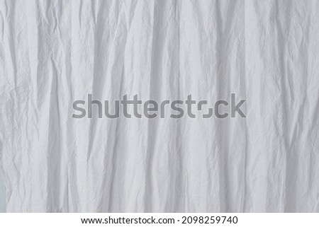 Crumpled white paper background. Top view. Copy space. 