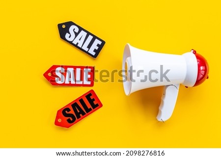 Sale announcement. Megaphone with price sale labels
