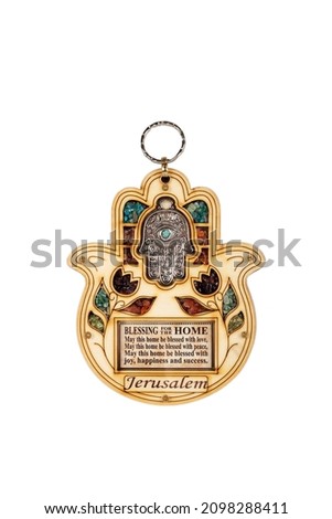 Wooden hamsa for blessing  with colourful stones  isolated on white background