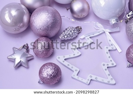 Christmas decorations very peri colors, figure silhouette of a Christmas tree, background.  purple, lilac color. happy new year background