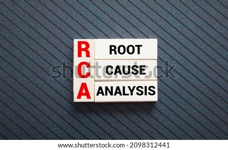 Closeup on businessman holding a card with ROOT CAUSE ANALYSIS message, business concept image with soft focus background Royalty-Free Stock Photo #2098312441