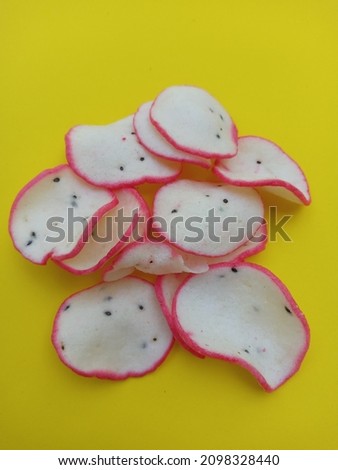 crunchy dragon fruit chips on yellow background 
