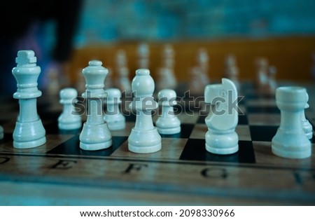 chess pieces on a wooden board
