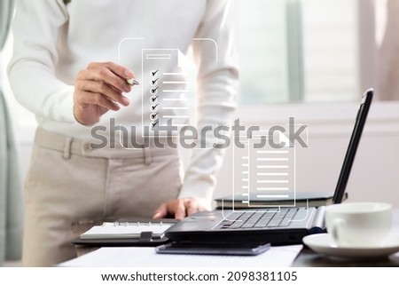 Hand of people check list on document icon to management data record system, Document management system concept Royalty-Free Stock Photo #2098381105