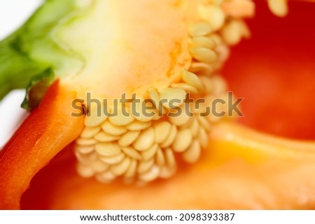 A close up of the cut into capsicum.  Showing the seeds and stem. Royalty-Free Stock Photo #2098393387