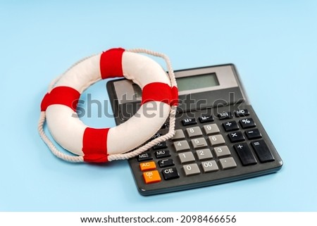 A lifeline on a calculator on a blue background. Concept of accounting assistance to business, financial security of deposits and money storage