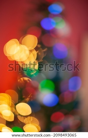 Christmas, blurred bokeh of Christmas lights on the Christmas tree, New Year.