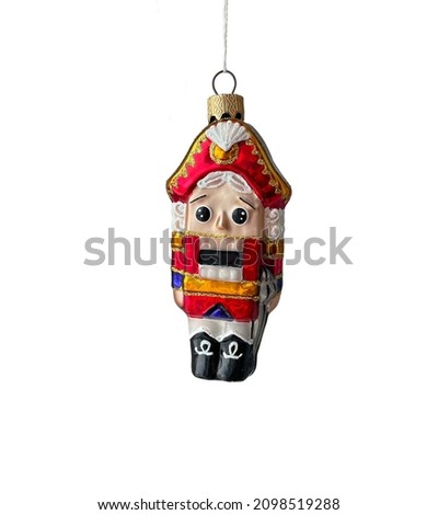 Christmas toy soldier Nutcracker in red traditional illustration isolated on white background.