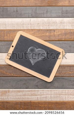 A heart drawn with chalk on a blackboard to declare your love on Valentine's Day