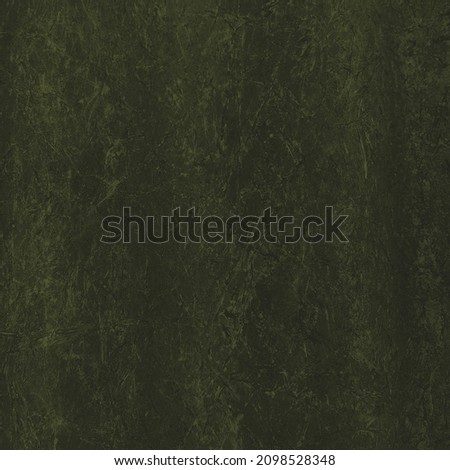 A wall with a dark grunge texture close-up. Texture - concrete or putty. The old wall. The green wall. Green background.