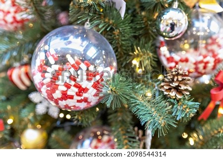 Christmas background of a Christmas tree decorated with Christmas toys.Winter holidays. New year
