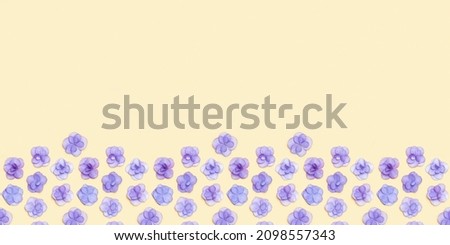 Minimal floral frame with small fresh Hydrangea violet flower, Very Peri color of year. Holiday layout with blooms for Mothers day, 8 March, Womens day. Top view, flat lay flowery fon with copy space