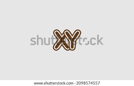 Bold letter XY logo with outline and circle outside, creative design.