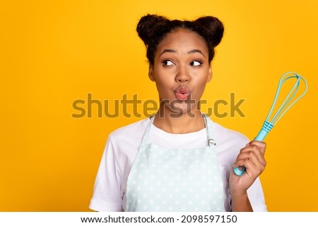 Photo of young lovely african woman plump lips curious look empty space hold whisk cook supper isolated over yellow color background Royalty-Free Stock Photo #2098597150