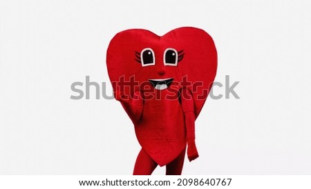 person in happy red heart costume dancing isolated on white