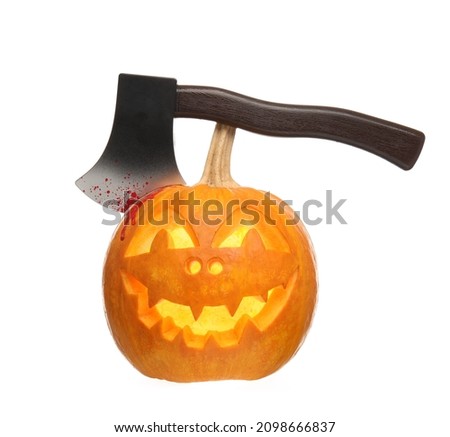 Carved pumpkin for Halloween with axe on white background