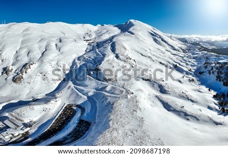 Aerial panorama of the popular ski are Kellaria at Mount Parnassos, Greece, during winter time with fresh snow and sunshine