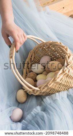Wallet with Easter eggs. Eggs are scattered on the floor.