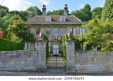 Exterior wall and entrance of an English country mansion house Royalty-Free Stock Photo #2098788691