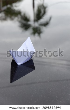 paper boat in selective focus 