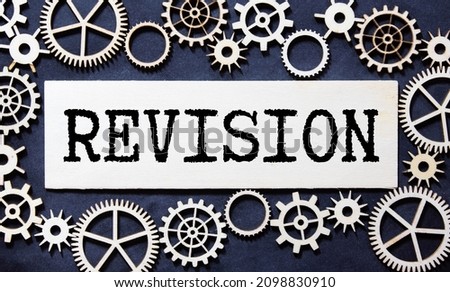 revision word made from metallic letterpress on dark jeans background. Royalty-Free Stock Photo #2098830910